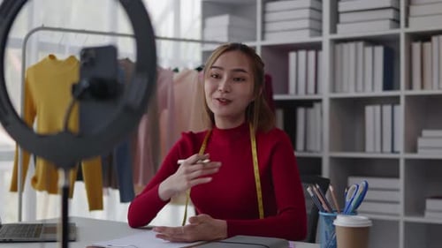 Fashion Designer Filming Video for Social Media