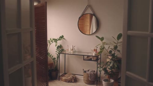 Contemporary Bathroom with Round Mirror and Greenery