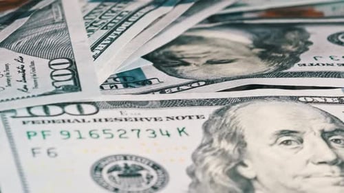 Macro Footage of Piled One Hundred Dollar Bills