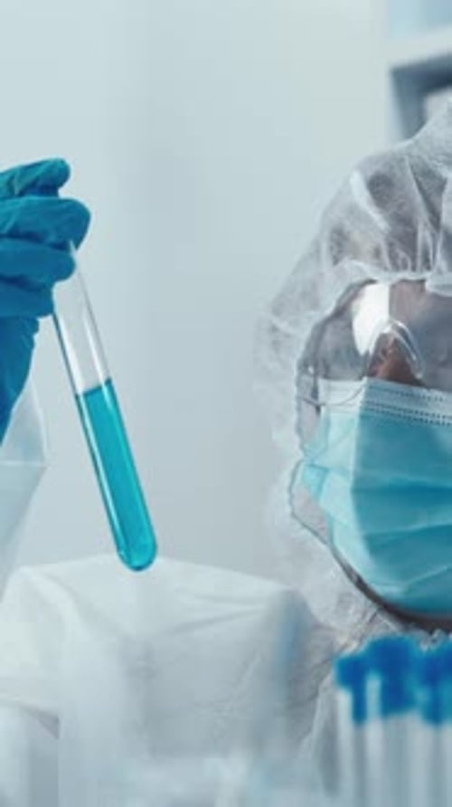 Medical Researcher Holding Test Tube in Laboratory