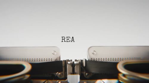 Old mechanical typewriter typing Reality in a close-up view.