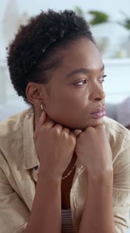 Young Woman Contemplating Indoors Close Up