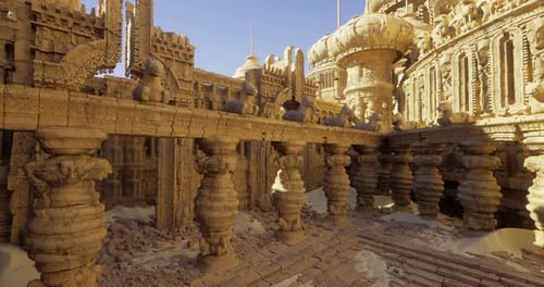 Intricate Sandstone Architecture with Towering Columns in Bright Sunlight
