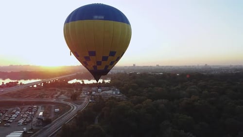 Captivating and Stunning Aerial View of a Colorful Hot Air Balloon at Beautiful Sunrise