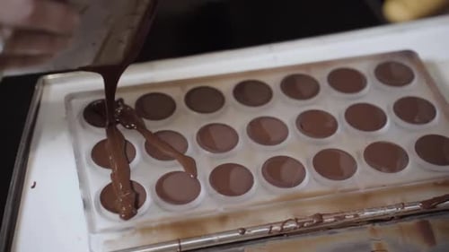 Pouring Liquid Into Molds - Close Up