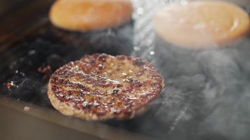 Street Food the Process of Cooking a Burger on the Grill Meat and Bun are Fried on the Grill Burger
