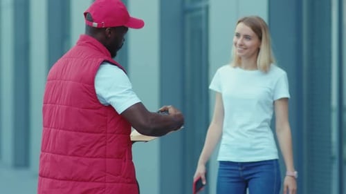 African American Delivery Man Hold Package Woman Client Paying By Contactless Terminal for Parcel
