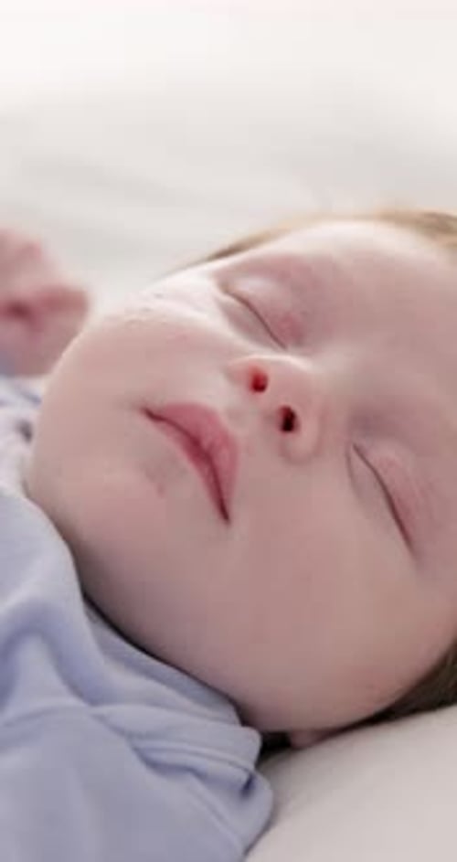 Close Up of Sleeping Baby Face on White