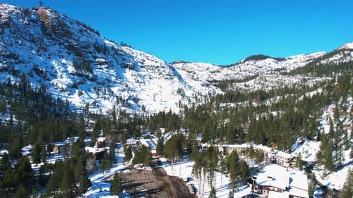 Aerial View of Lake Tahoe Ski Resort on Sunny Winter Day, Palisades, Olympic Valley, Drone Shot