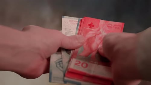 Counting Swiss Franc Banknotes Close Up