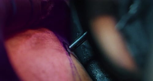 Milan/Italy-01.02.2019:Slow motion of professional master of the art of tattooing doing a tattoo t