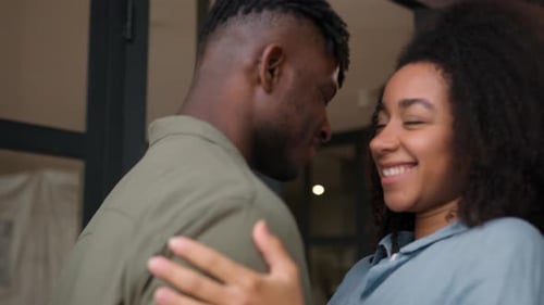 Joyful Couple Embrace Lovingly Indoors
