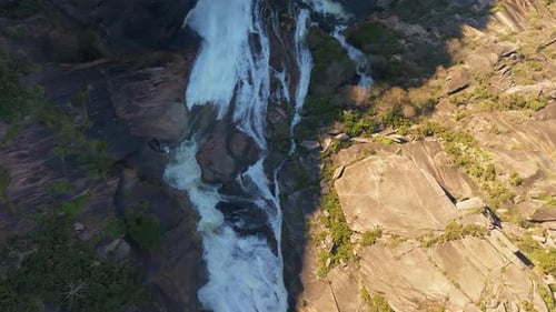 Fervenza do Ezaro - Waterfall Cascading Through Rocky Terrain In Dumbria, Spain. aerial topdown shot