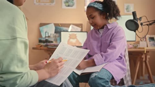 Girl Studying Math with Helper at Home
