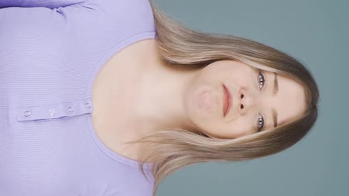 Young Woman Touching Her Face, Portrait