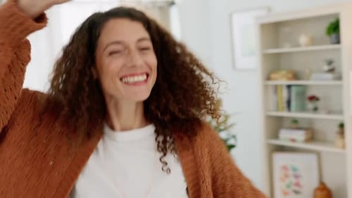 Woman Dancing and Smiling in Home Living Room