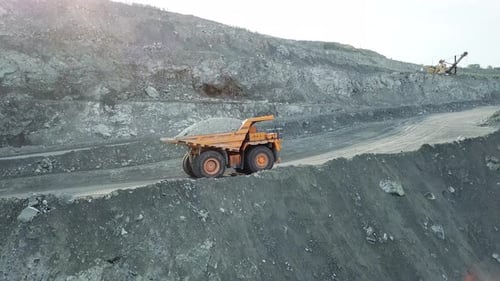 Mining Truck Carrying Coal on a Mountain Road