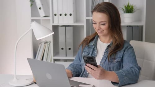 A Young Woman Works Diligently in Her Modern Stylish Workspace Blending Creativity and