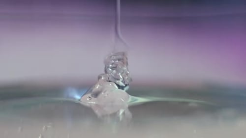 Clear Liquid Pouring onto Surface