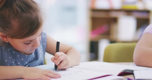 Children Drawing and Coloring in the Classroom