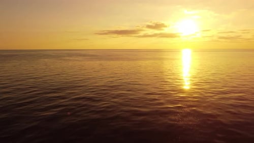 Aerial View on Golden Sunset Over Calm Sea Horizon