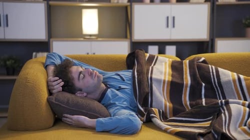 Man snoring in his sleep.