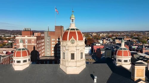 Ornate Building with Clock Tower and American Flag