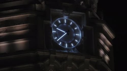 Cybele Palace clock illuminated at night Madrid, Spain