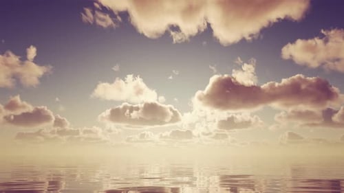 Beautiful sunset over the sea or ocean slowly moving waves and clouds.