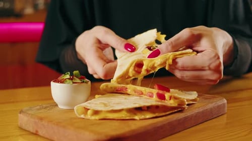 Close Up of Cheese Quesadilla Eating Traditional Mexican Food Tex Mex Cuisine