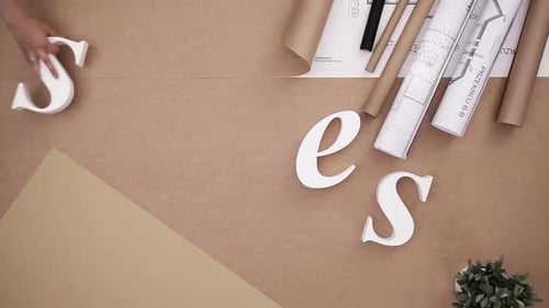 Businesspeople building a word together on a table for success