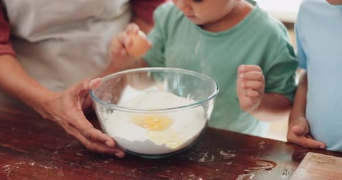 Baking, learning and kid mix food ingredients in a home with parent for cooking in kitchen