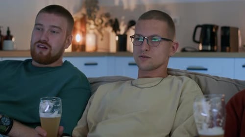 Friends Relaxing at Home Drinking Beer