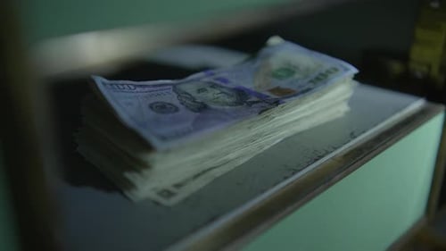 Young Sales Bank Manager Searching Dark Vault Safe Room Using Flashlight