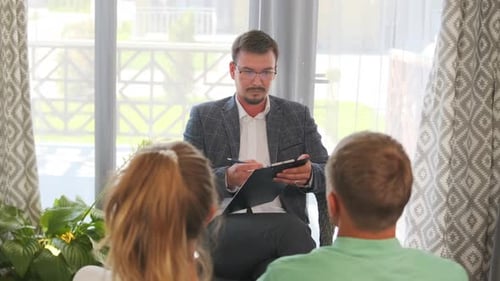 Therapist Consults Couple in Bright Room