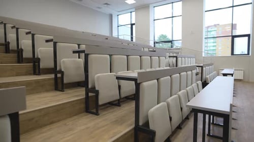 Spacious Lecture Hall with Rows of Soft Upholstered Chairs