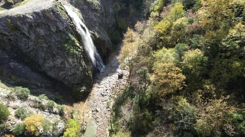 Aerial View of Waterfall Surrounded by Green Trees