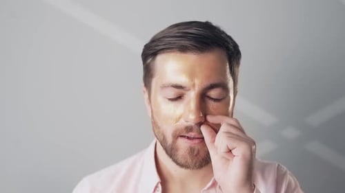 Man Peels Off Golden Face Mask