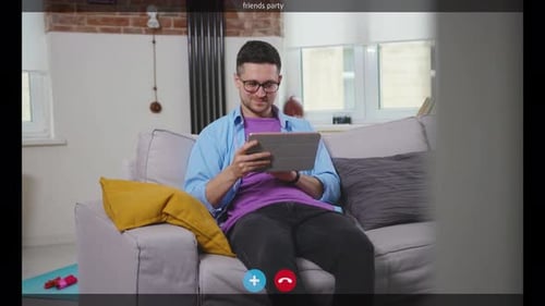 Man Chatting On Tablet Computer