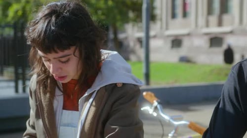 Girl Having Talk and Spending Day with Friends Outdoors on College Campus