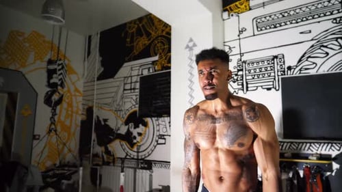 Muscular Afro American Sportsman Performing Intense Barbell Curl Exercises at Modern Gym Athletic