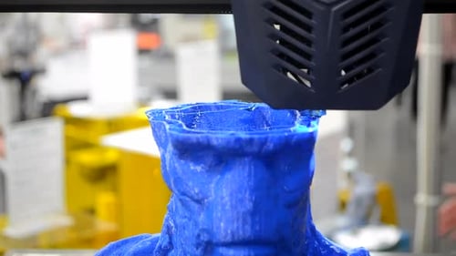 3D Printer Constructs Blue Bust