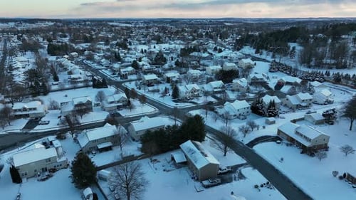 Winter Aerial View of Snowy Suburban Neighborhood