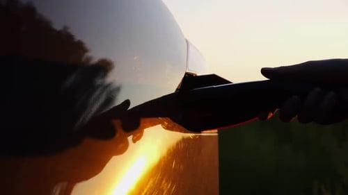 Electric Car Charging in Golden Hour Sunlight