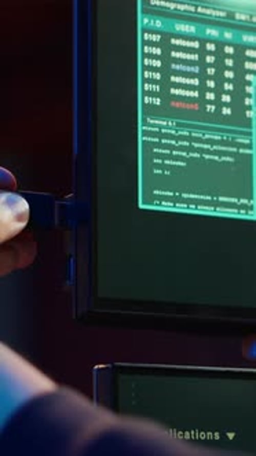 Vertical Video Hacker Uploading USB Flash Drive with Stolen Data in PC