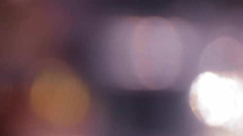 Abstract Background with Moving Defocused Orbs of Light