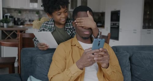 Loving Boy Surprises Father with Handmade Birthday Card
