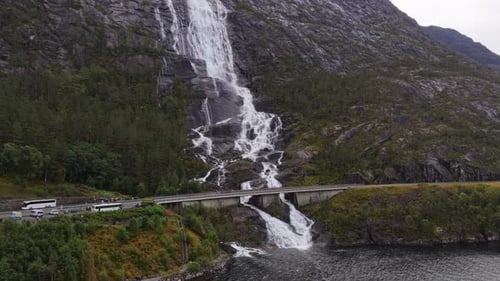 Langfossen plunges into scenic river gorge in Norway aerial image