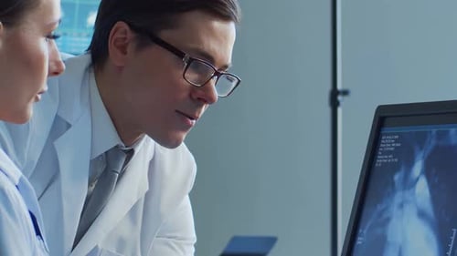 Professional Medical Doctors Working in Hospital Office Making Computer Research Medicine Healthcare