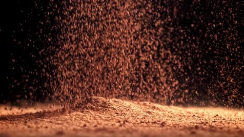 Cocoa Powder Falls on the Table Filmed on a Highspeed Camera at 1000 Fps